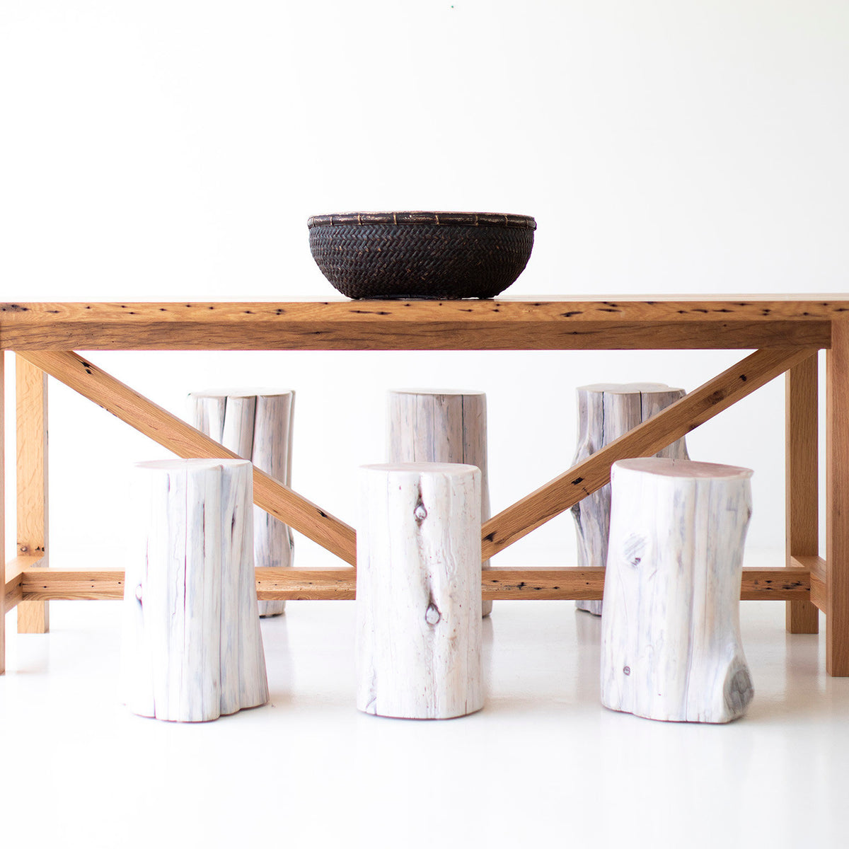 Modern luxury teak farmhouse dining table with hand-shaped white oak stump stools by Bertu Home