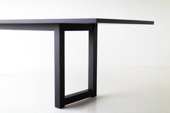 Modern luxury solid black walnut dining table by Bertu Home shown at an angle