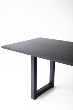 Side profile of the modern luxury black walnut dining table by Bertu Home