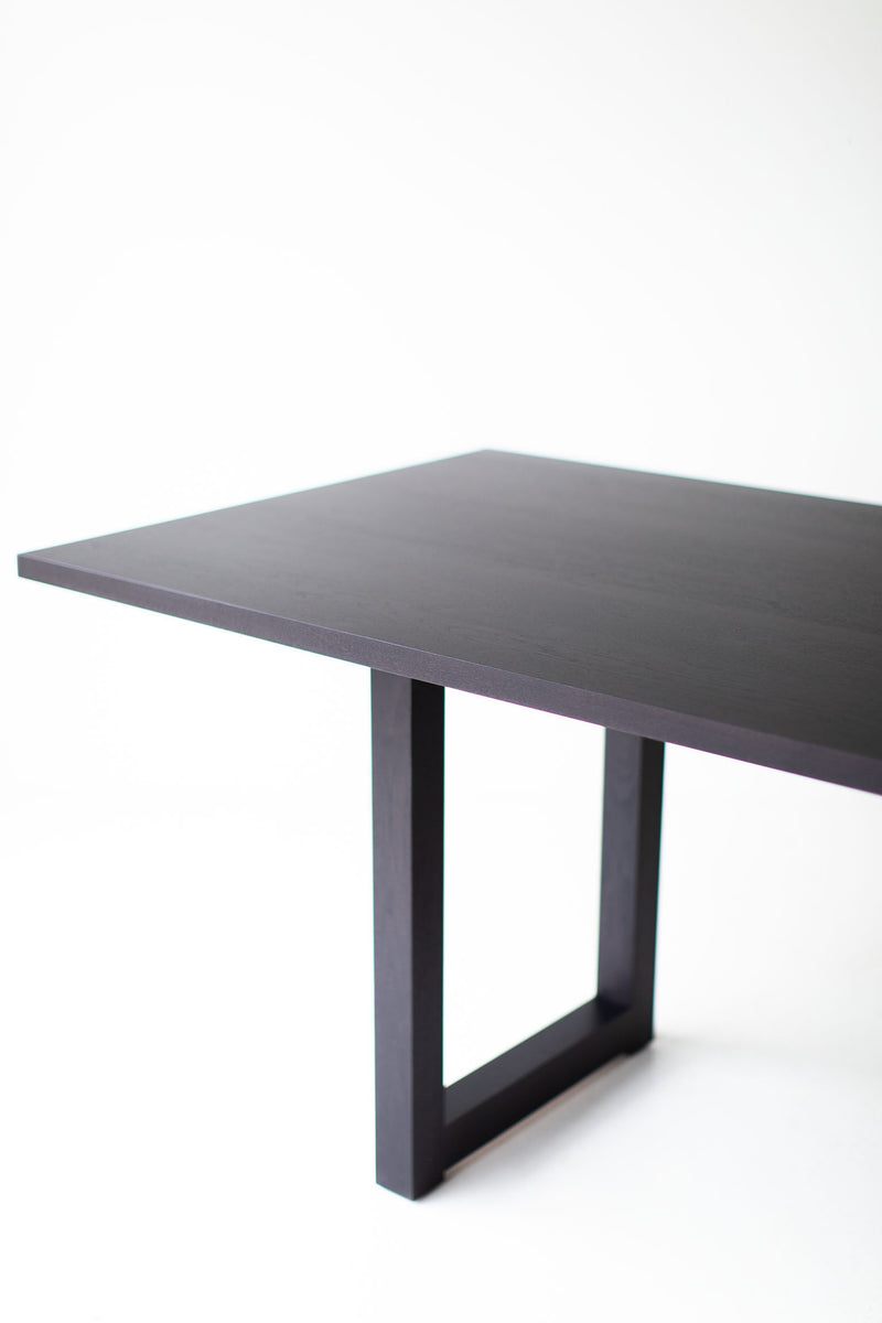 Side profile of the modern luxury black walnut dining table by Bertu Home