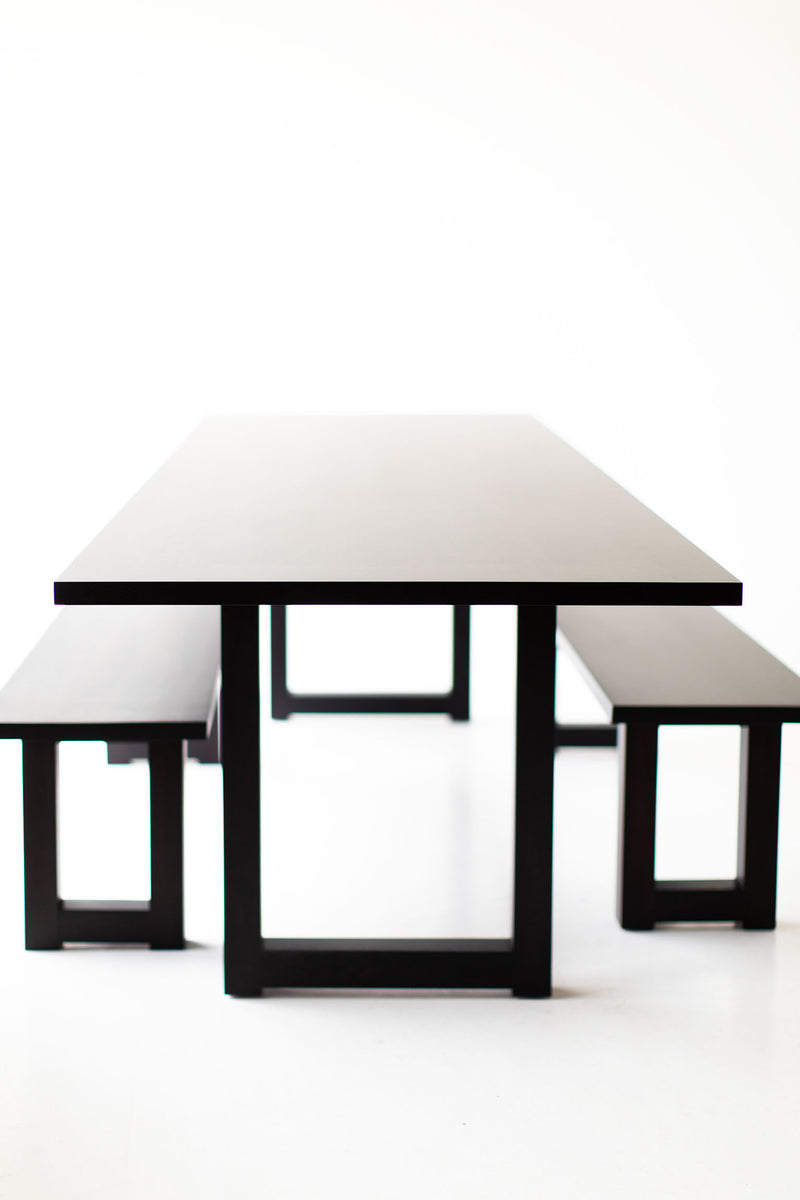 Modern luxury black walnut table styled as an oversized desk