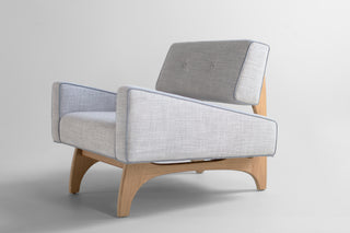 Canadian modern lounge chair in white oak, showing the sculptural arched white oak base