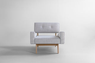 Canadian modern lounge chair in white oak, side profile showing the splayed oak legs