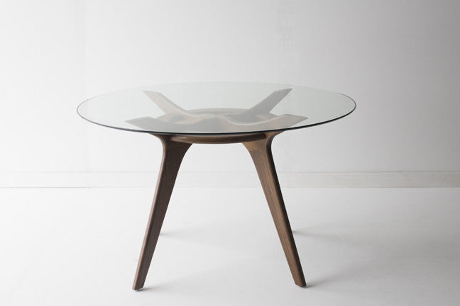 Craft modern dining table showing solid walnut base construction