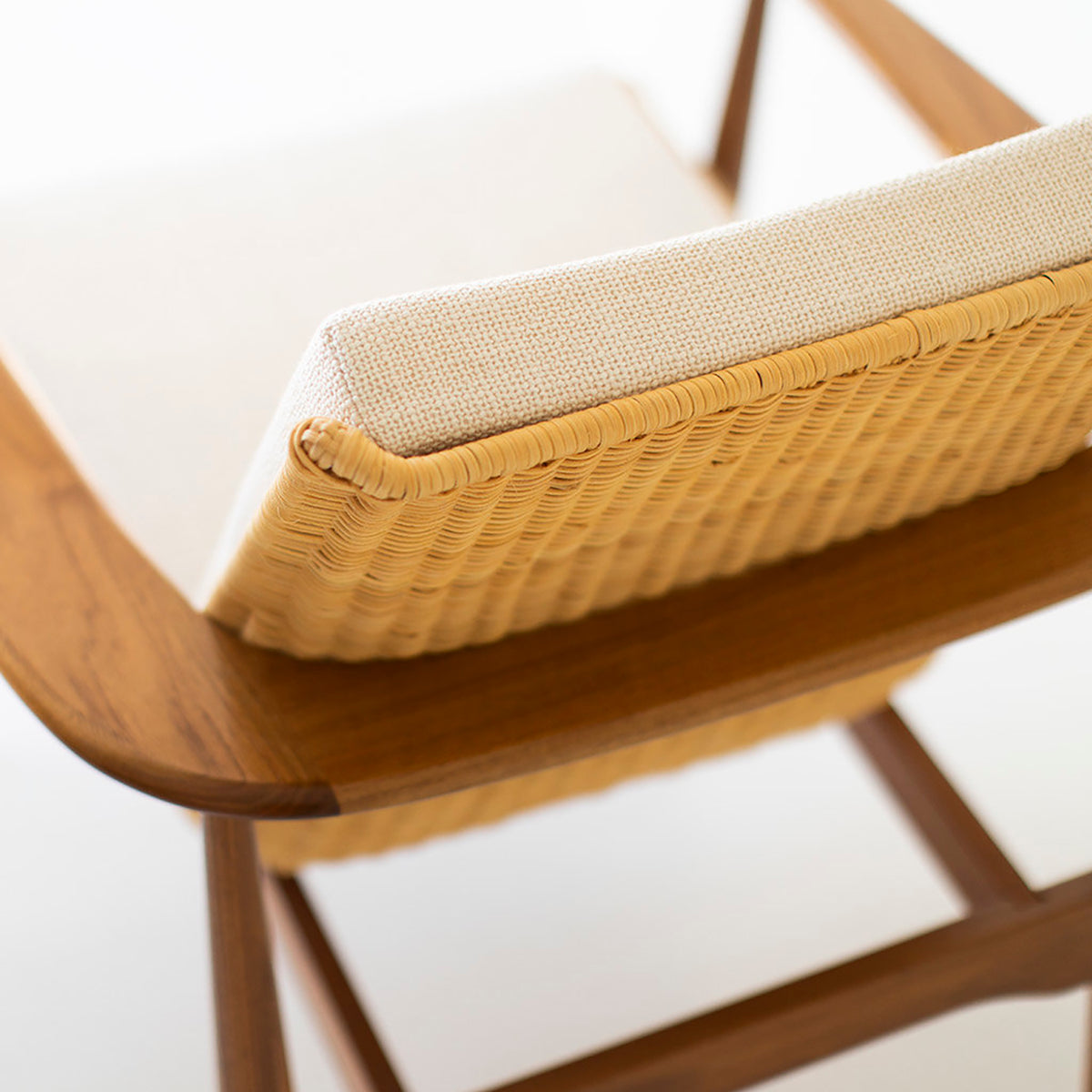 Modern luxury walnut and woven wicker lounge chair by Craft Associates, a licensed Lawrence Peabody design