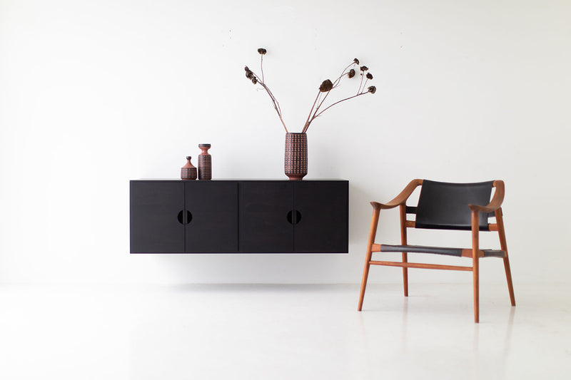 Modern luxury floating walnut cabinet styled as a media console