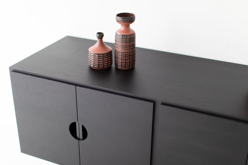 Detail of the Cali Collection cut-out pull on the modern cabinet