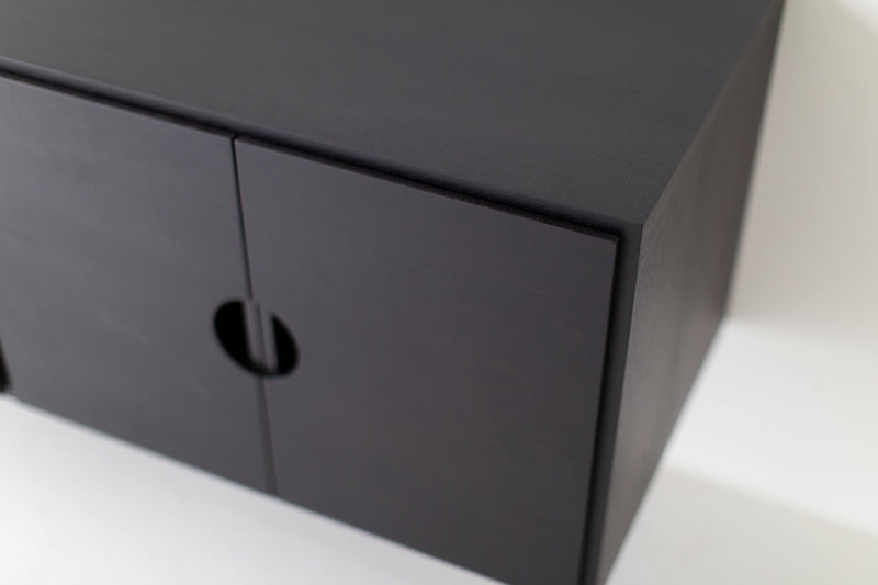 Modern luxury floating walnut cabinet shown wall-mounted