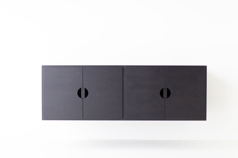 Modern luxury floating walnut cabinet styled in a living room