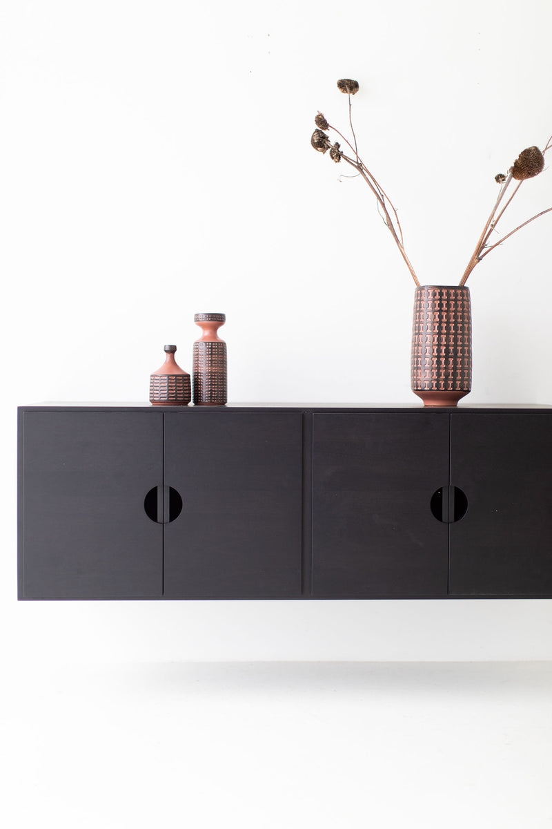 Modern luxury floating walnut storage cabinet shown from the side