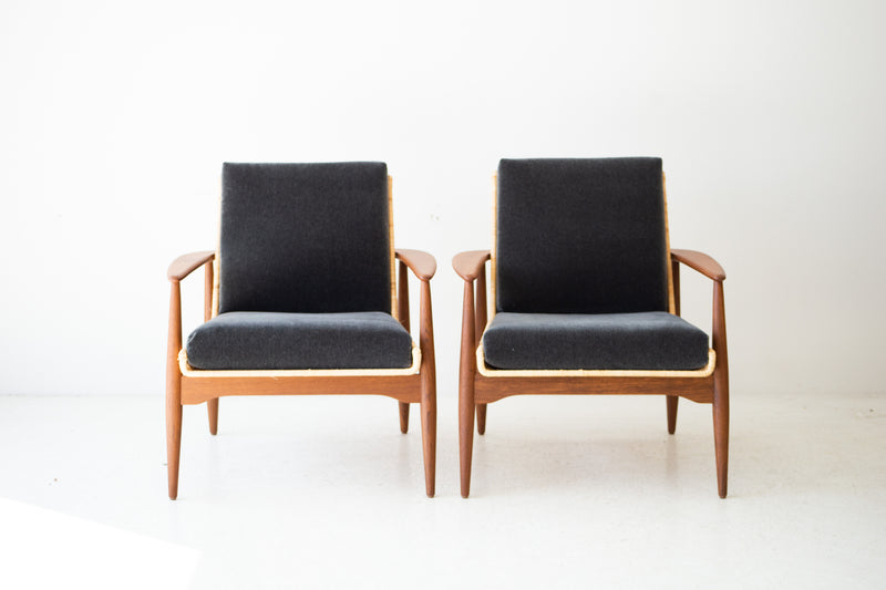 Modern luxury Lawrence Peabody 1806P wicker lounge chairs in matte teak, pair shown front-on with charcoal mohair cushions