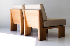 Front view of the oak Chile side chair with its cushioned seat and back