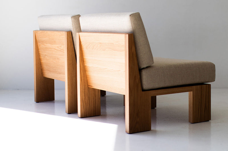 Front view of the oak Chile side chair with its cushioned seat and back