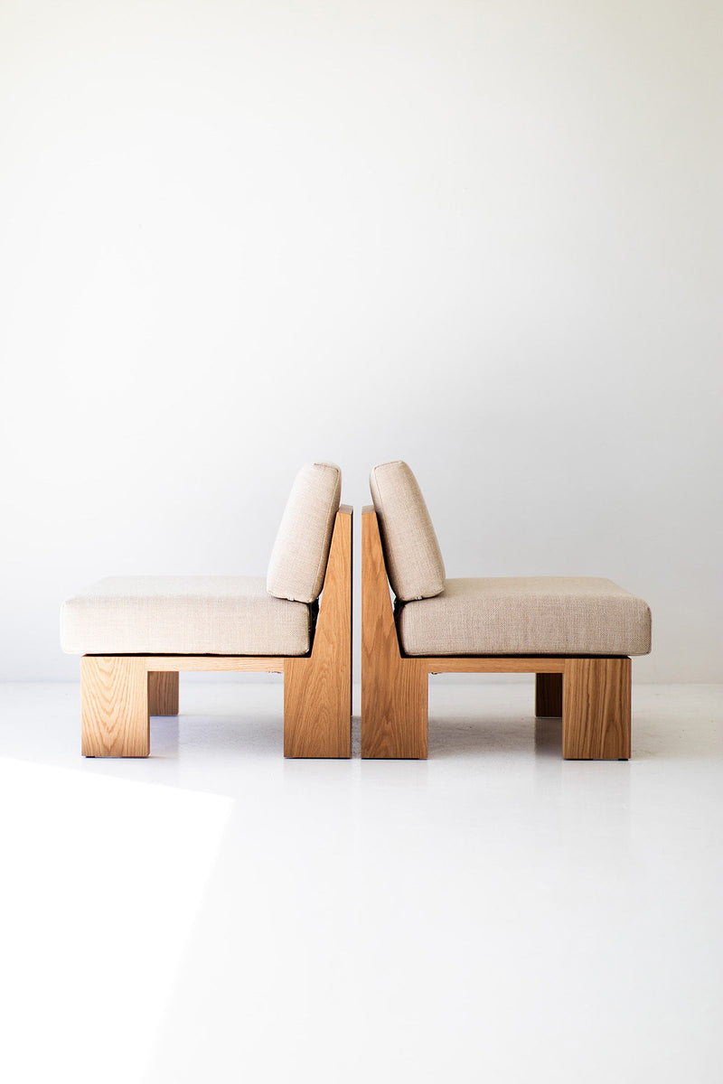 Side profile of the oak lounge chair showing its clean, simple lines