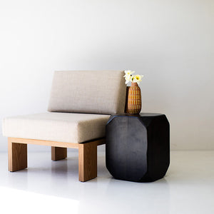 may include - modern luxury oak lounge chair with minimalist design, featuring clean lines and simple sleek shape. Chair sits in a clean white room with white floors. The overall aesthetic is modern. 07