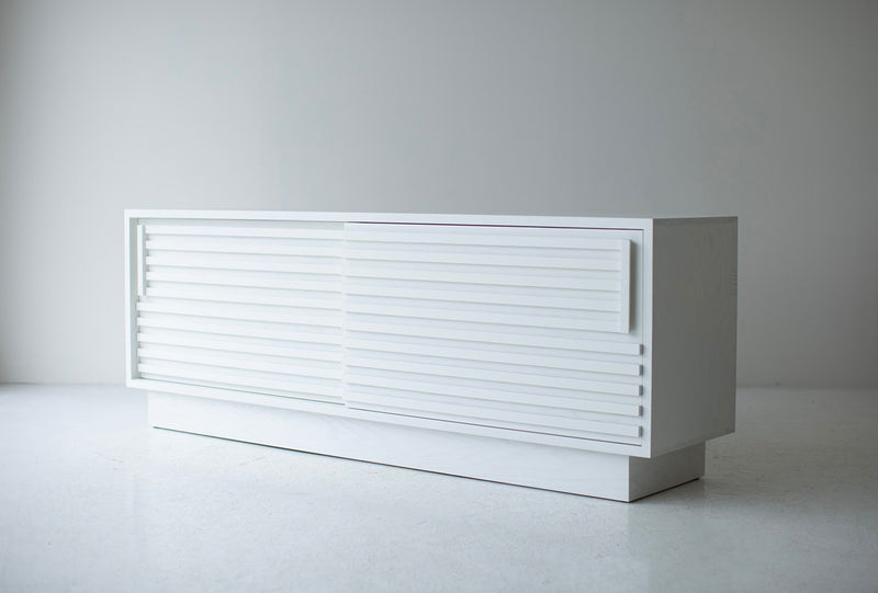 Modern luxury solid oak credenza in a white matte finish with sliding doors, front view