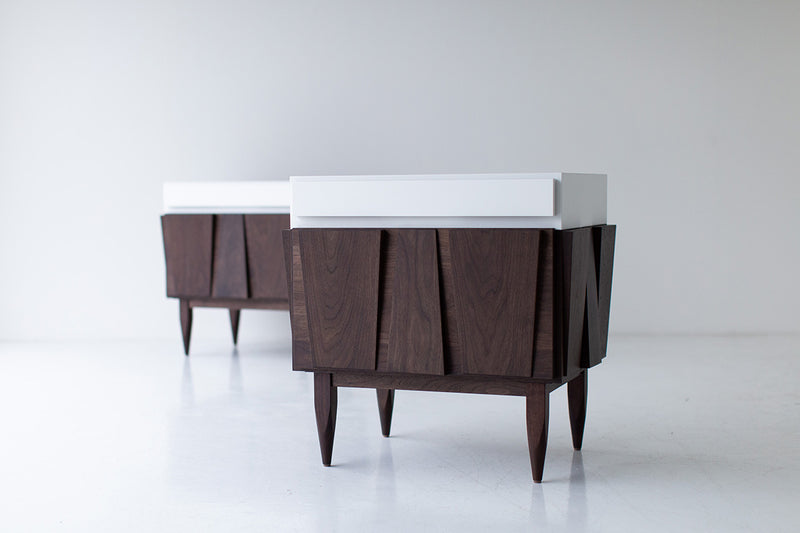 Angled view of the modern Eiger nightstand in solid walnut