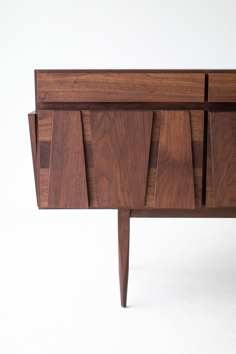Handcrafted modern Eiger walnut credenza by Craft Associates® shown at a three-quarter angle