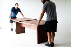 Close-up of the hand-finished matte walnut tabletop