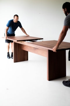 Detail of the solid walnut legs and base, The Toko dining table