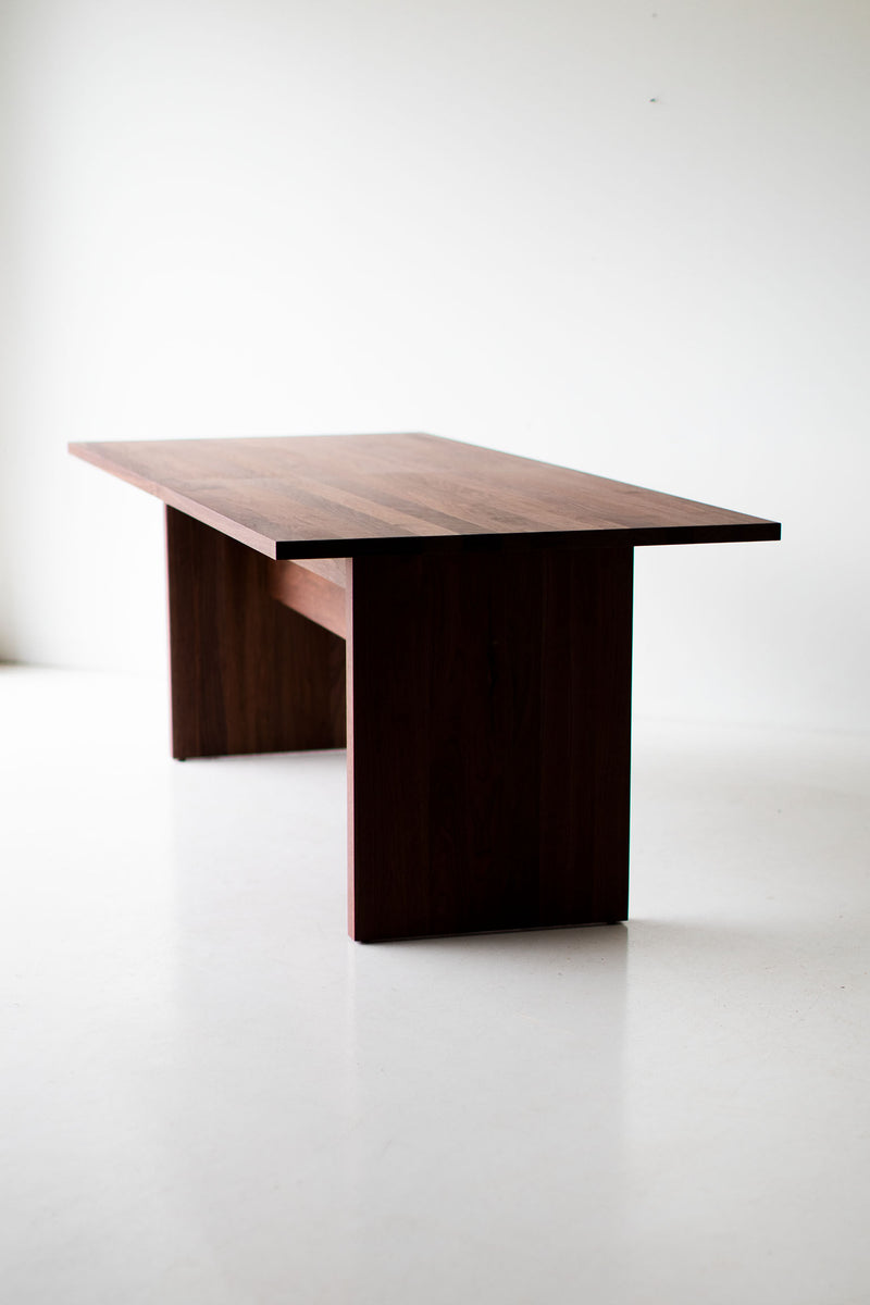 Modern luxury walnut dining table, The Toko, styled in a dining room