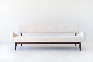 Modern luxury Canadian sofa in walnut by Craft Associates®, handcrafted walnut-legged sofa, front view