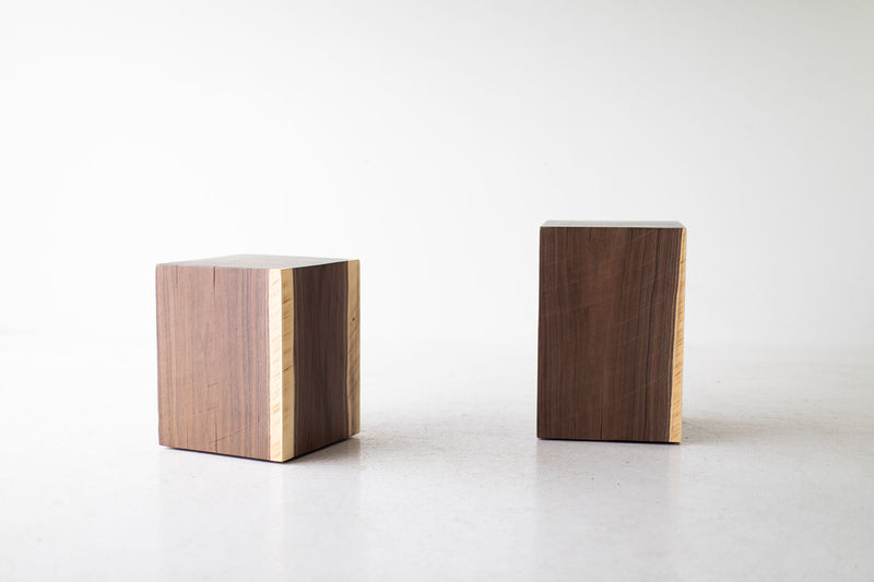Pair of walnut stump tables styled together