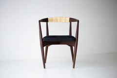 Modern luxury walnut and cane dining chair by Lawrence Peabody for Craft Associates, front view