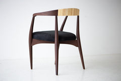 Modern luxury cane and walnut dining chairs styled around a dining table