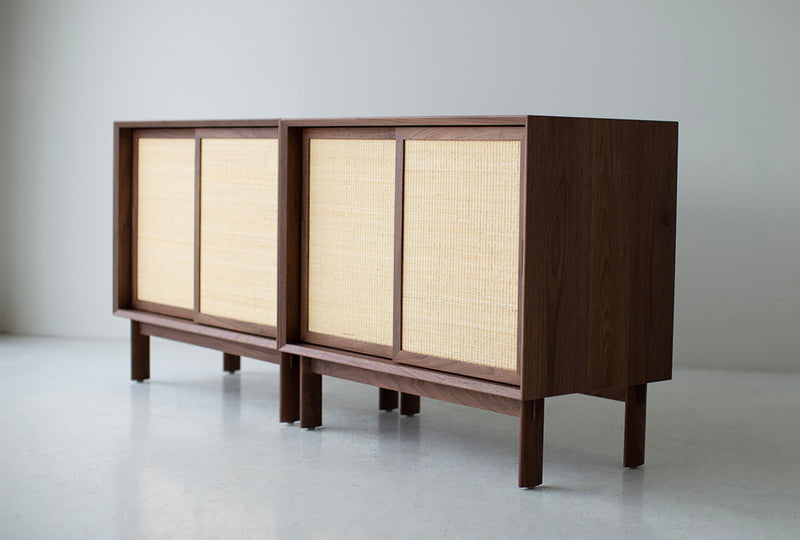 Modern luxury walnut credenza with sliding cane front doors, designed by Lawrence Peabody