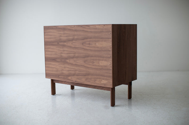 Modern luxury cane front credenza styled in a living room