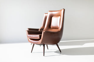 Modern luxury Peabody high back wing chair with a solid walnut frame by Craft Associates®, front view