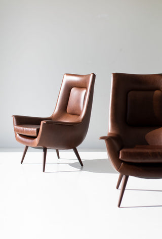 Side profile of the modern luxury Peabody high back wing chair showing its tall, sheltering silhouette