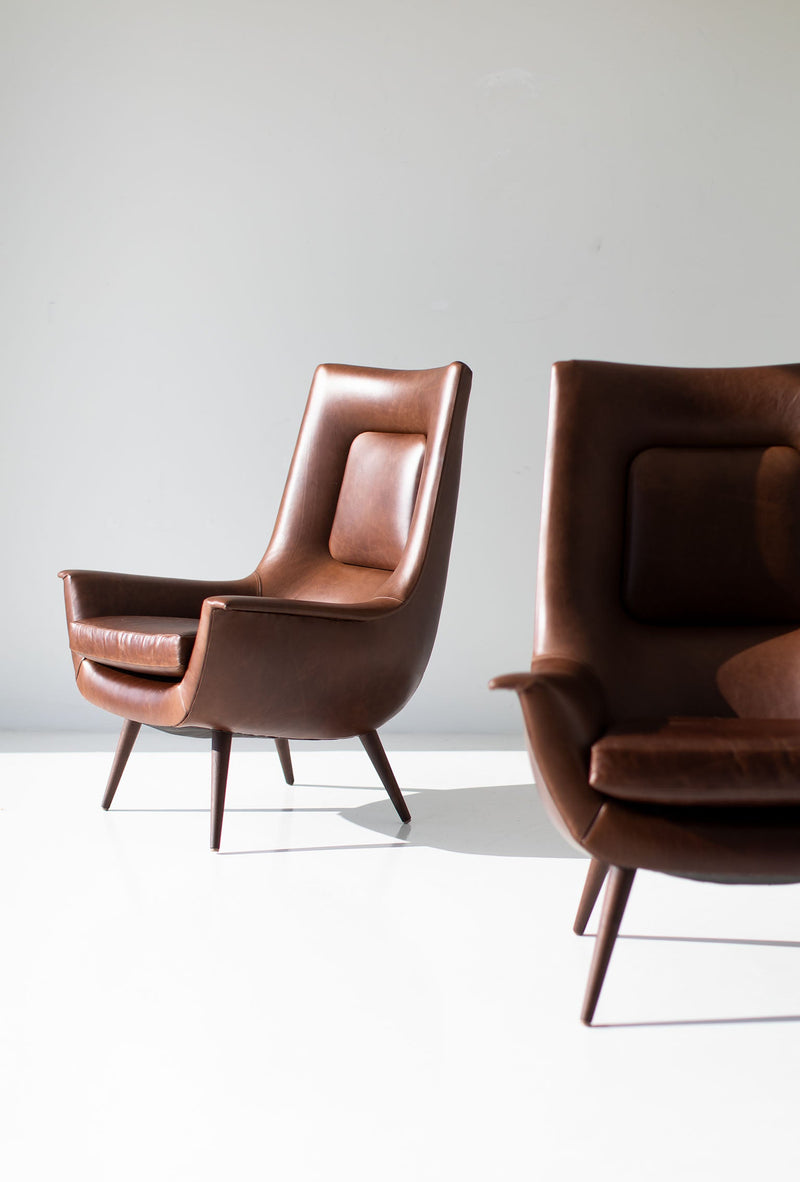 Side profile of the modern luxury Peabody high back wing chair showing its tall, sheltering silhouette