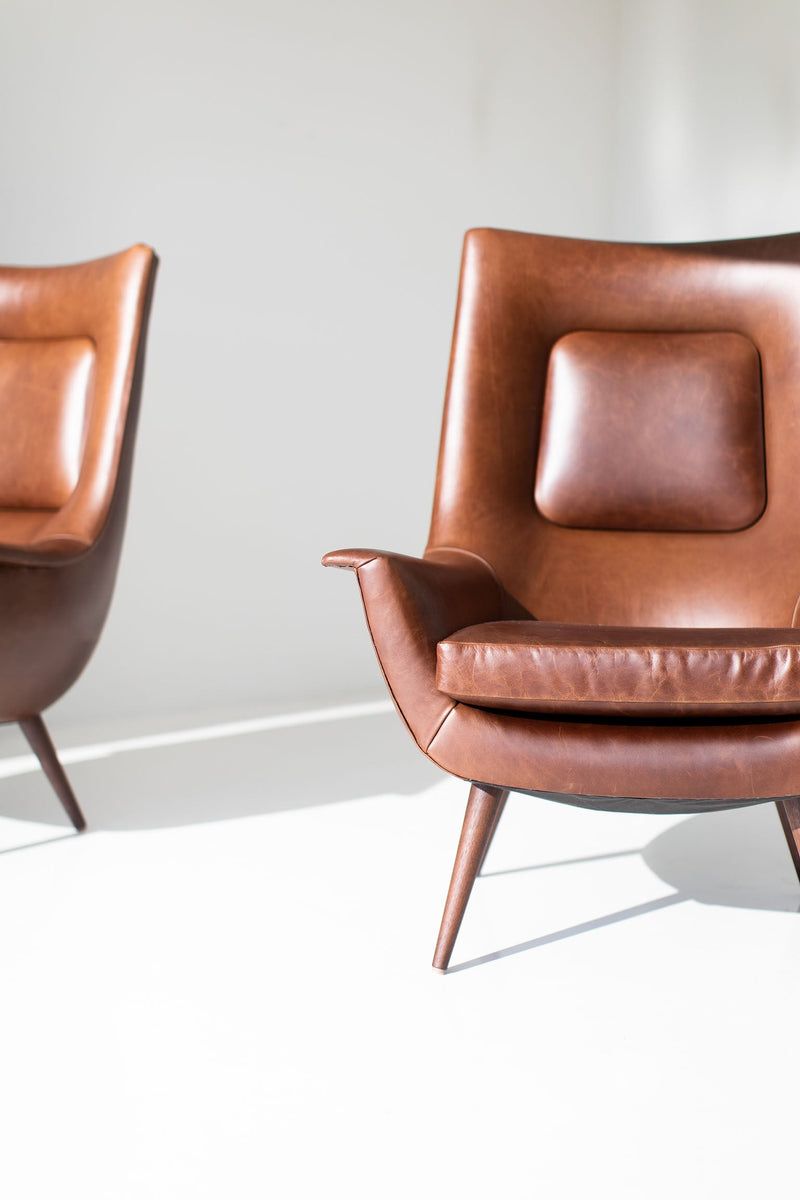 Detail of the hand-applied oil finish on the modern luxury Peabody walnut wing chair