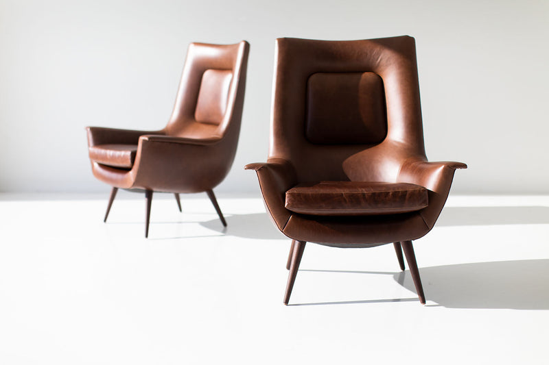 Angled view of the modern luxury Peabody high back wing chair showcasing its sculptural silhouette