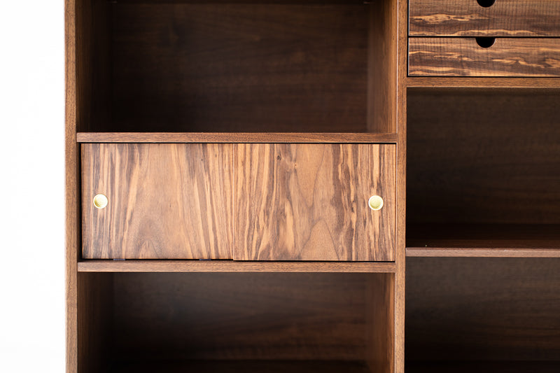Close-up of the Claro walnut veneer on the bookcase doors
