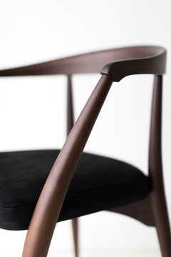 Close-up of the walnut grain along the arm and frame
