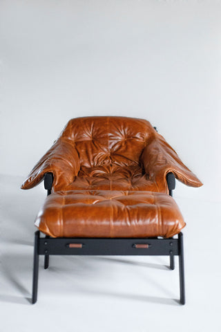 Front view of the Percival Lafer MP-41 lounge chair and ottoman in dark walnut