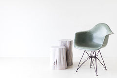 Tree stump table styled as a side table in a living room