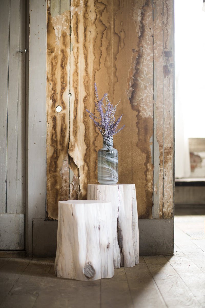 Tree stump table shown from above displaying the natural wood rings