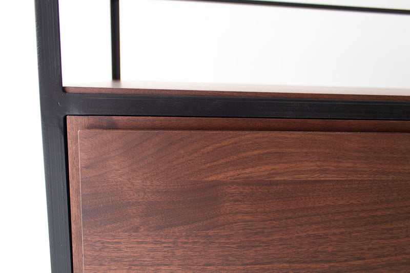 Detail of the precise cut-out design on the luxury storage cabinets