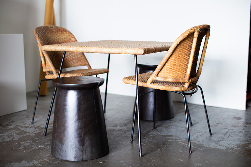 Several stools grouped together as a larger table