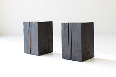 Burnt shou sugi ban side table styled in a bright interior