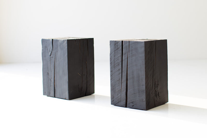Burnt shou sugi ban side table styled in a bright interior