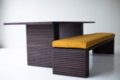 Modern luxury Cicely bench styled at the foot of a bed