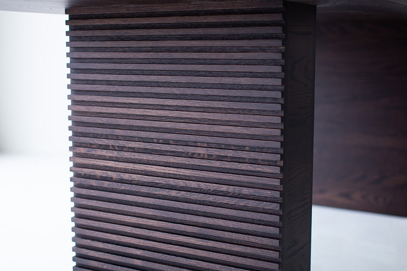 Cicely oak dining table shown at an angle