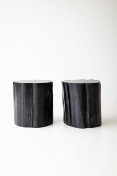 Modern luxury black stump side table in a modern living room