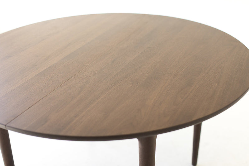 Close-up of the brass inserts on the Peabody table leaf
