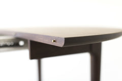 Angled view of the Peabody walnut dining table